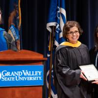 Christine Rener and Provost presenting award to recipient